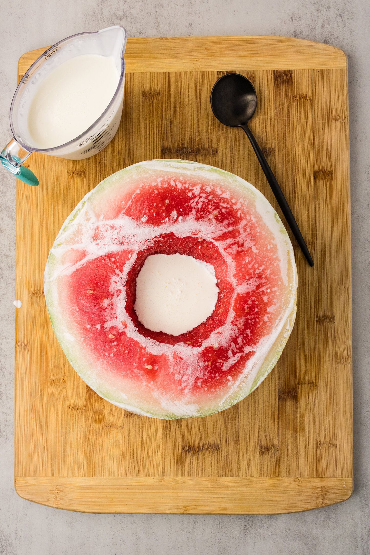 heavy cream poured in watermelon