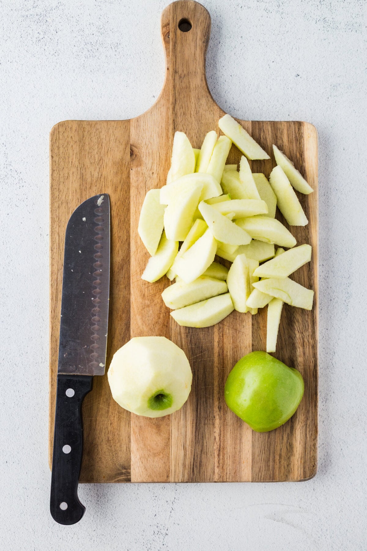 slicing apples on a cutting board