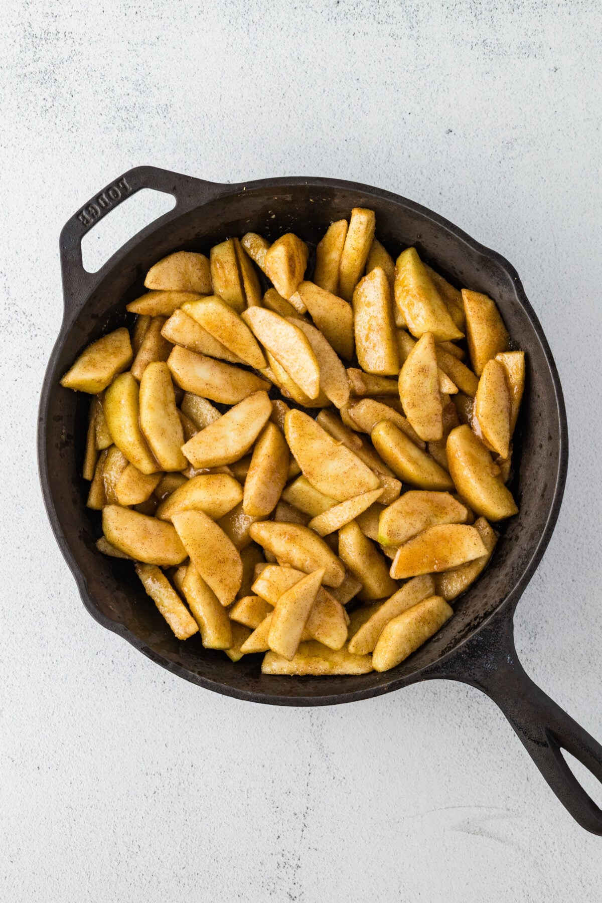 apples in skillet with melted butter