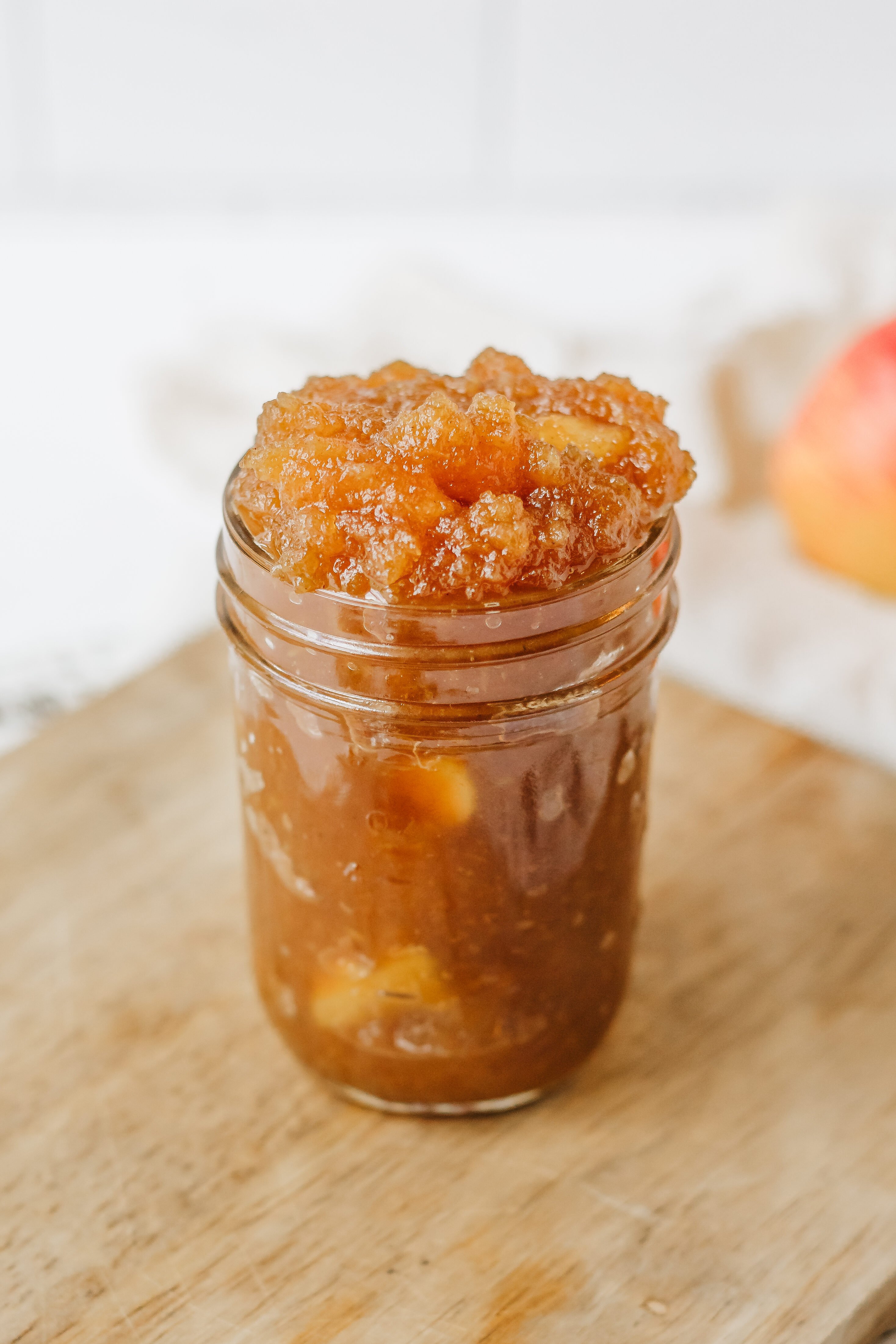 overfilled jar of apple jam