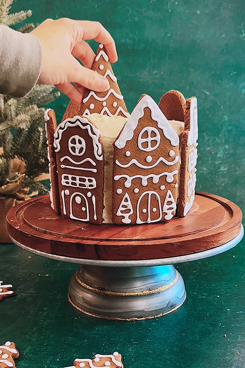 adding tree to gingerbread village cake