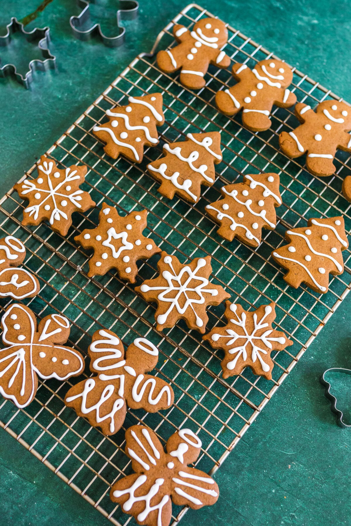 decorated gingerbread cookies on a cooling wire rack