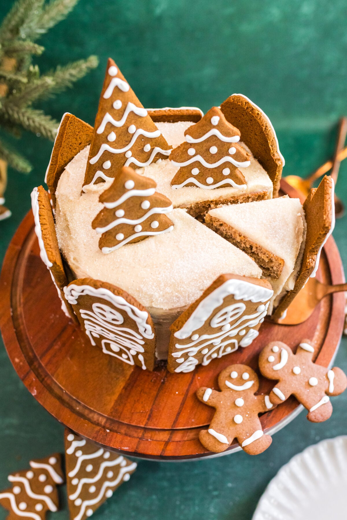 cutting a slice out of the gingerbread village spice cake