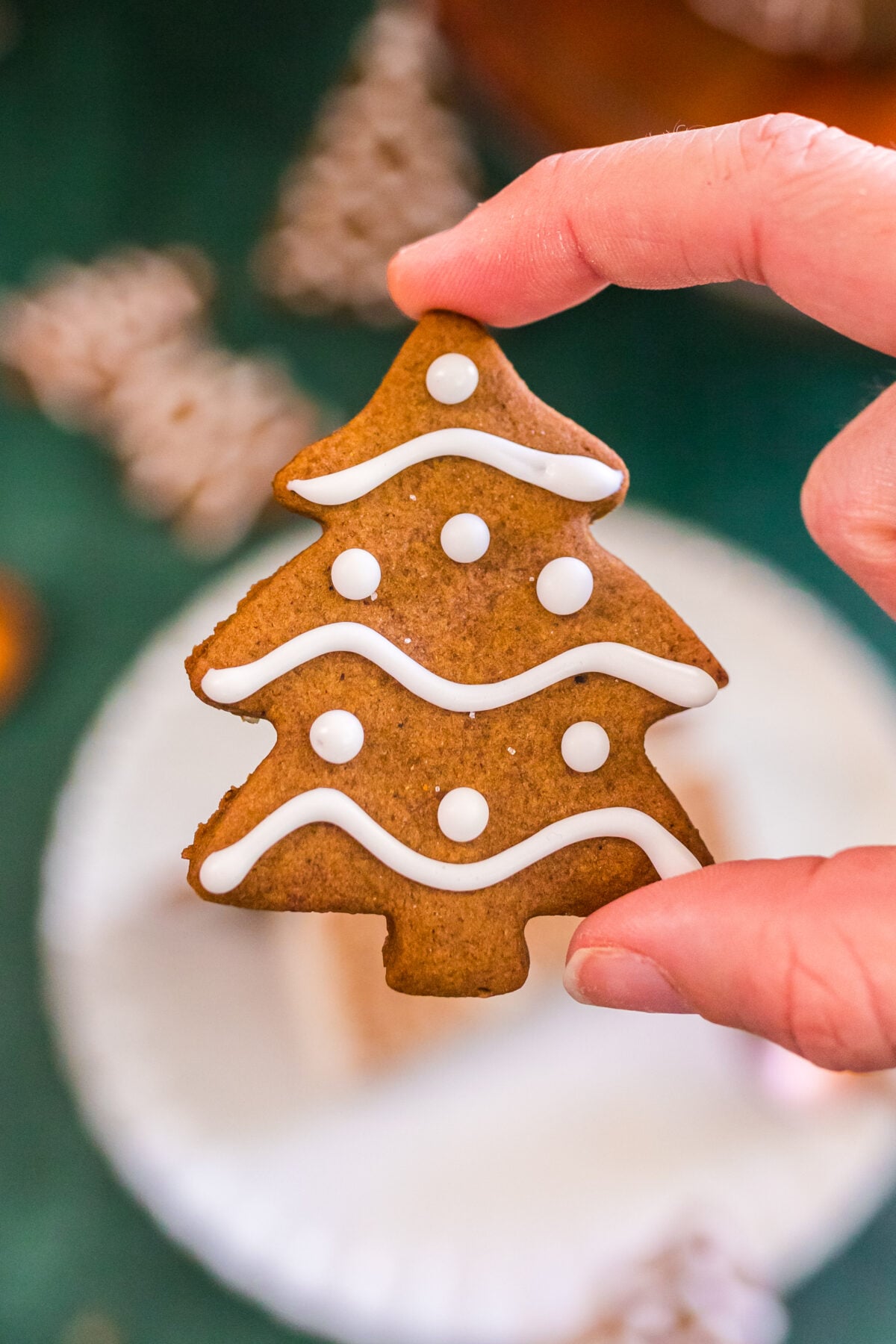 gingerbread cookie in the shape of a christmas tree