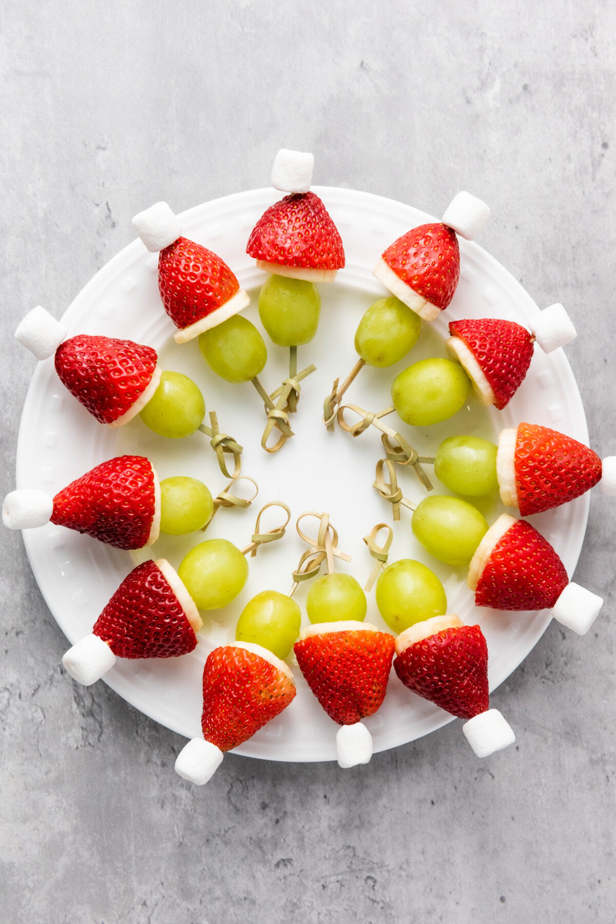 plate of grinch fruit kabobs