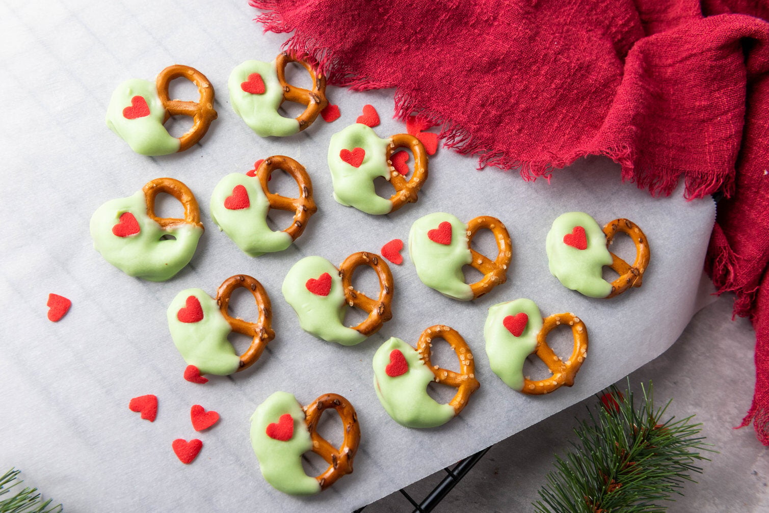 grinch pretzels on parchment paper