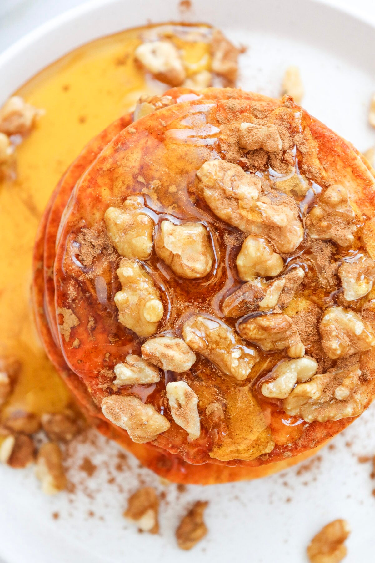 pumpkin pancakes with walnuts and syrup