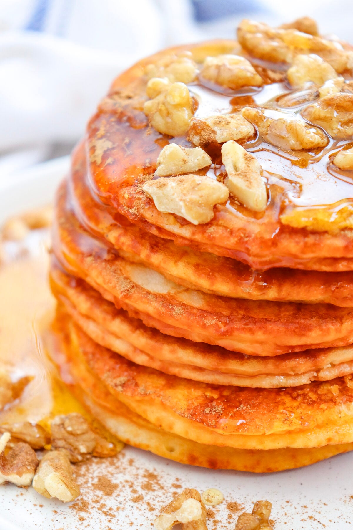 pumpkin pancakes with walnuts and syrup
