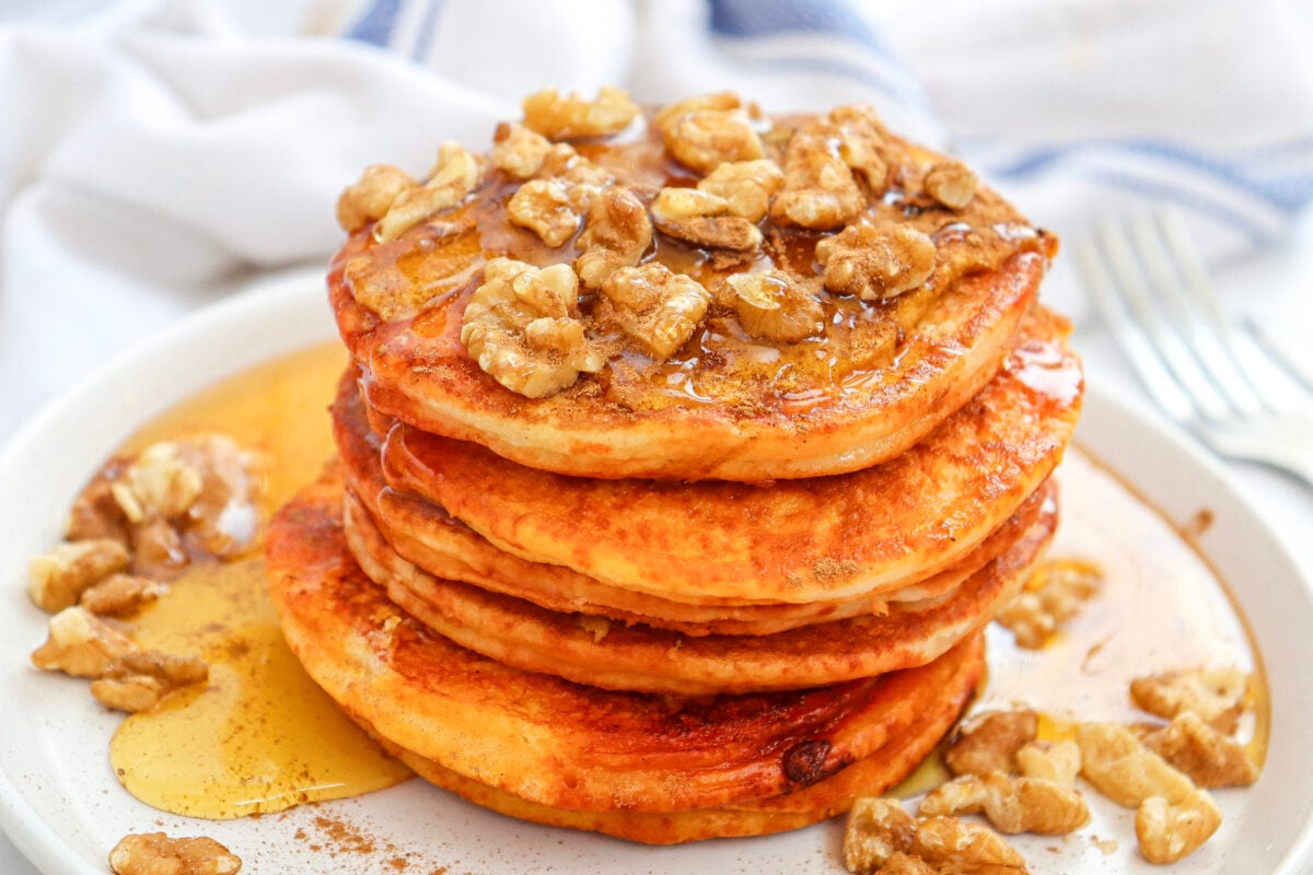 pumpkin pancakes with walnuts and syrup
