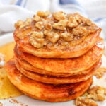 pumpkin pancakes with walnuts and syrup