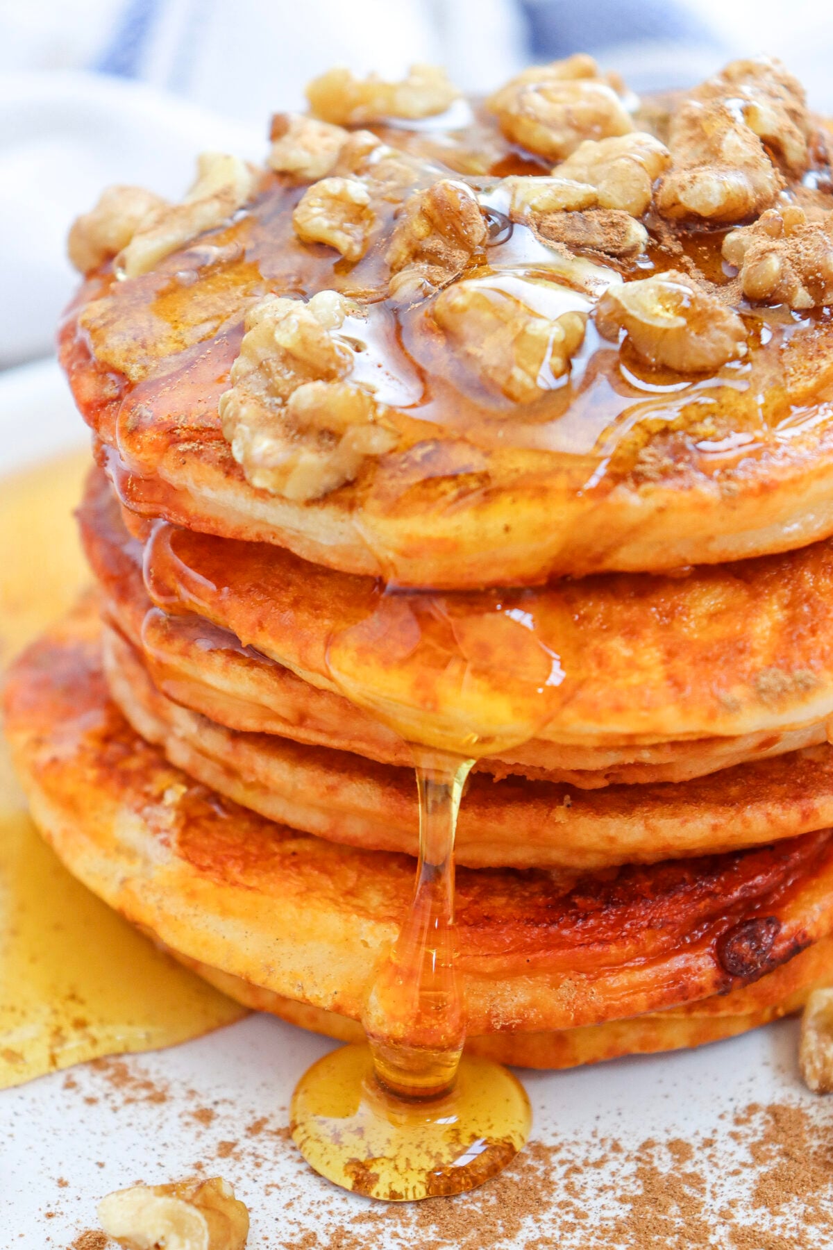 pumpkin pancakes with syrup dripping