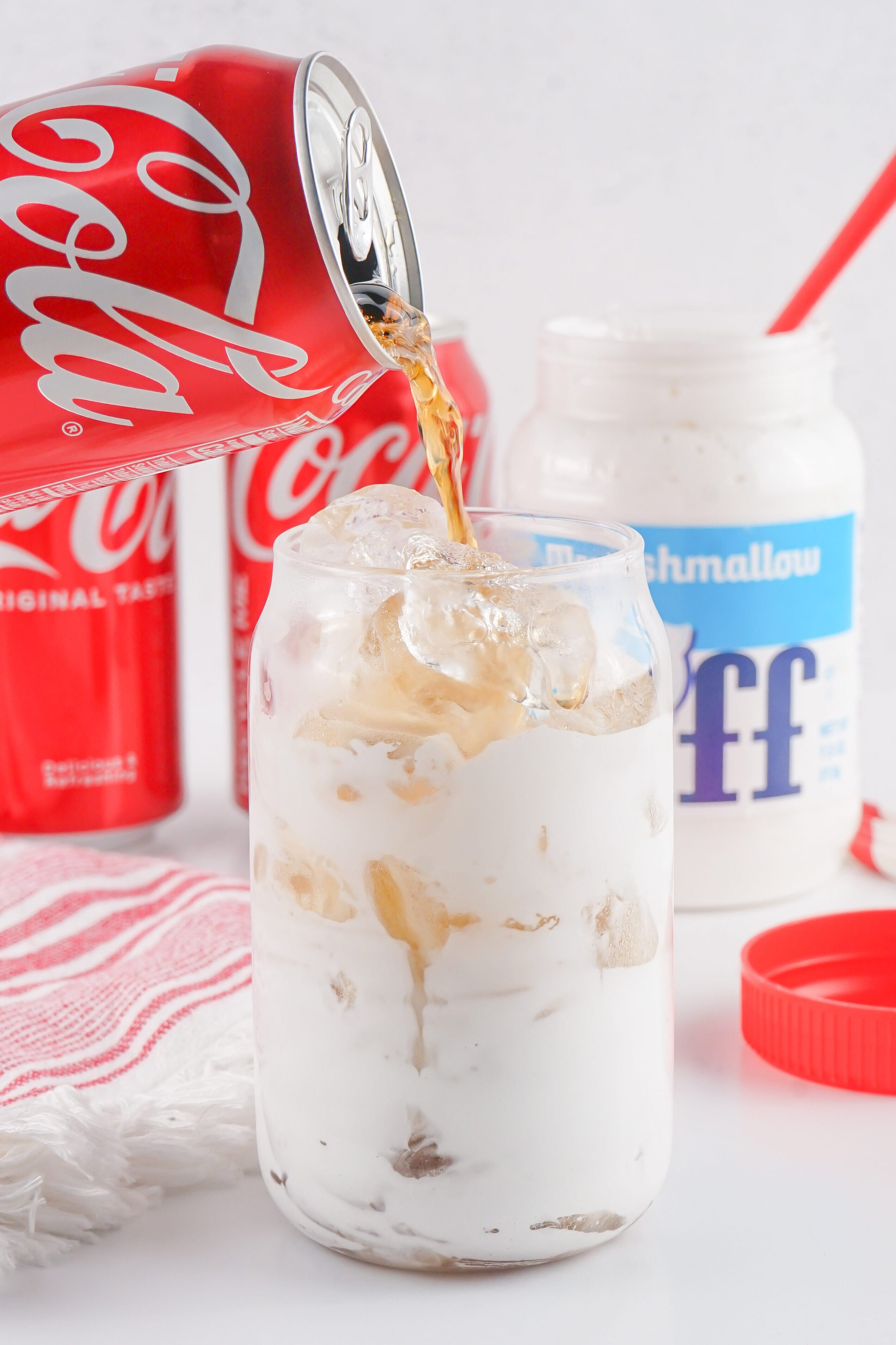 pouring coke into the glass