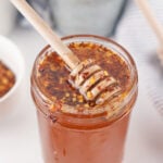 hot honey in a jar with a honey dipper