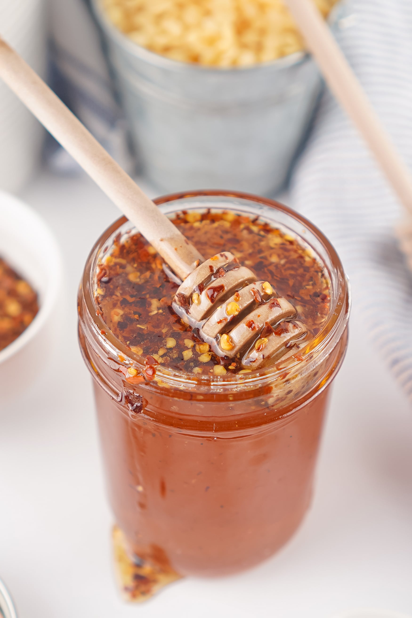 hot honey in a jar with a honey dipper