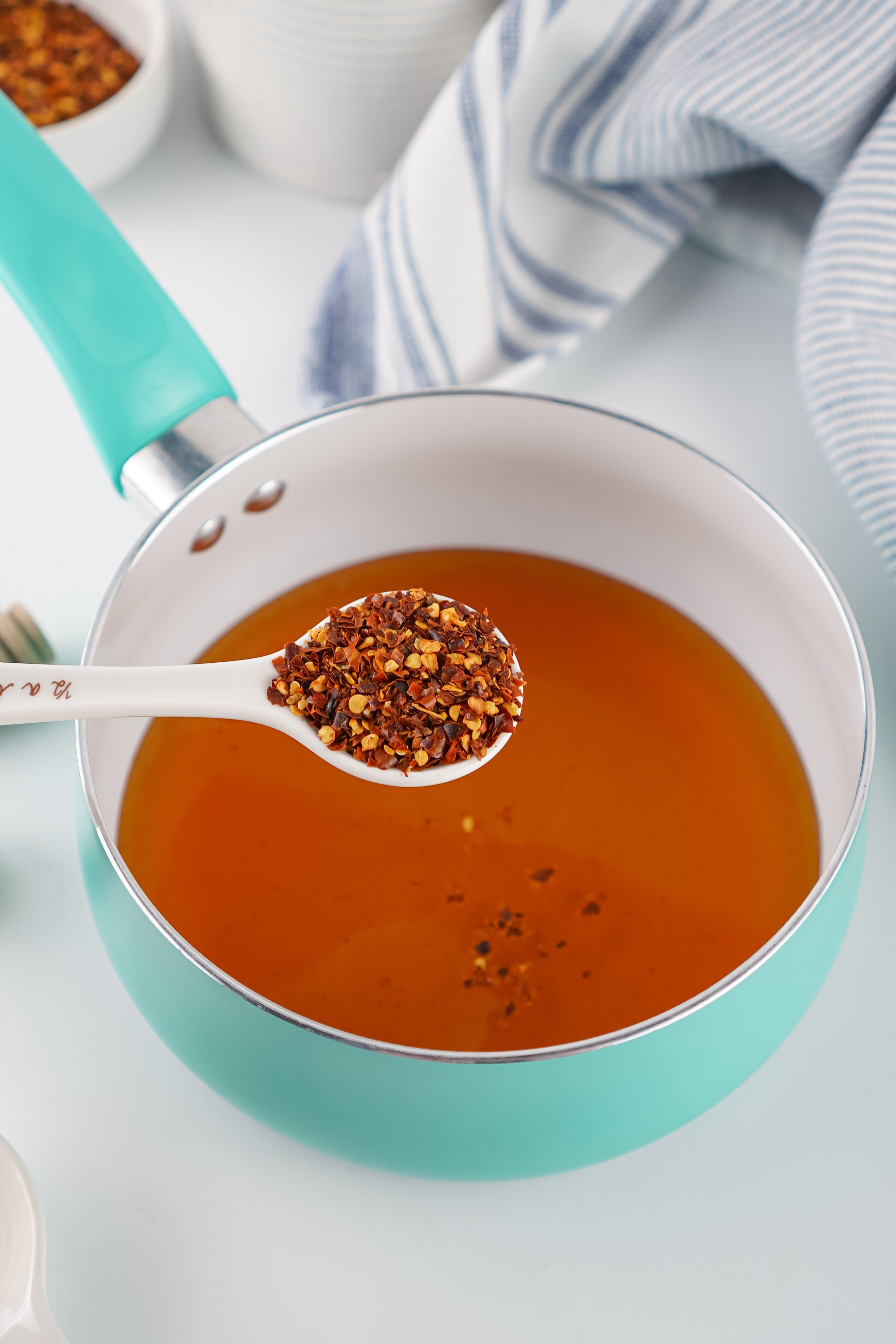 adding red pepper flakes to honey