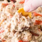 dipping bacon cheeseburger dip with a frito