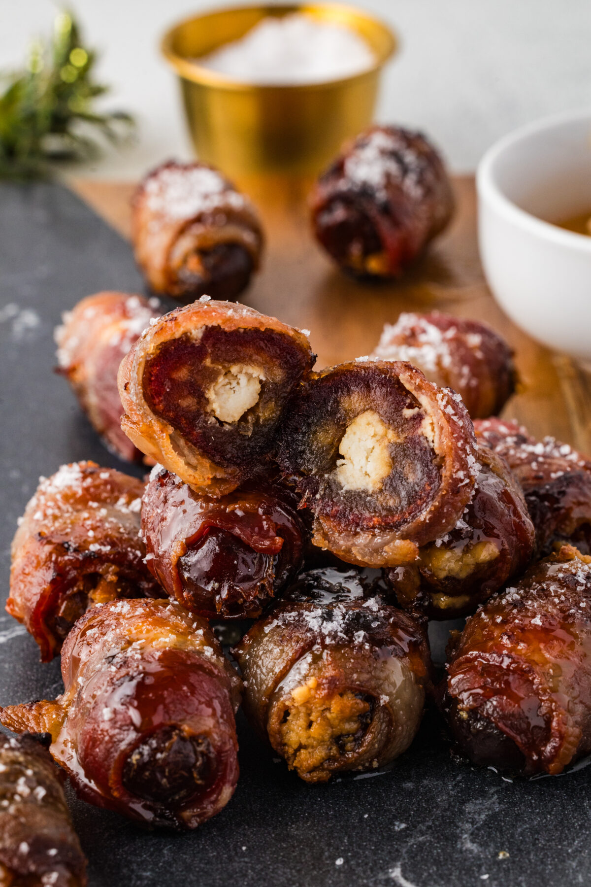 stack of bacon wrapped dates with one cut in half
