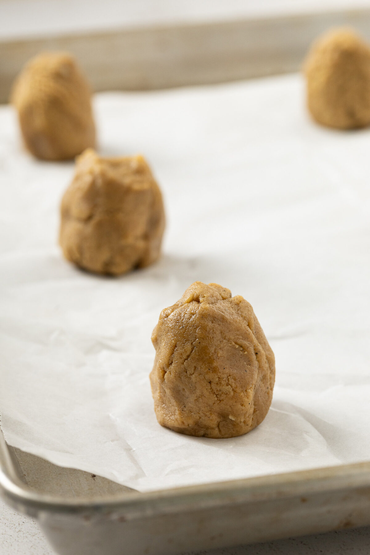 portions of dough in tall cylinders frozen
