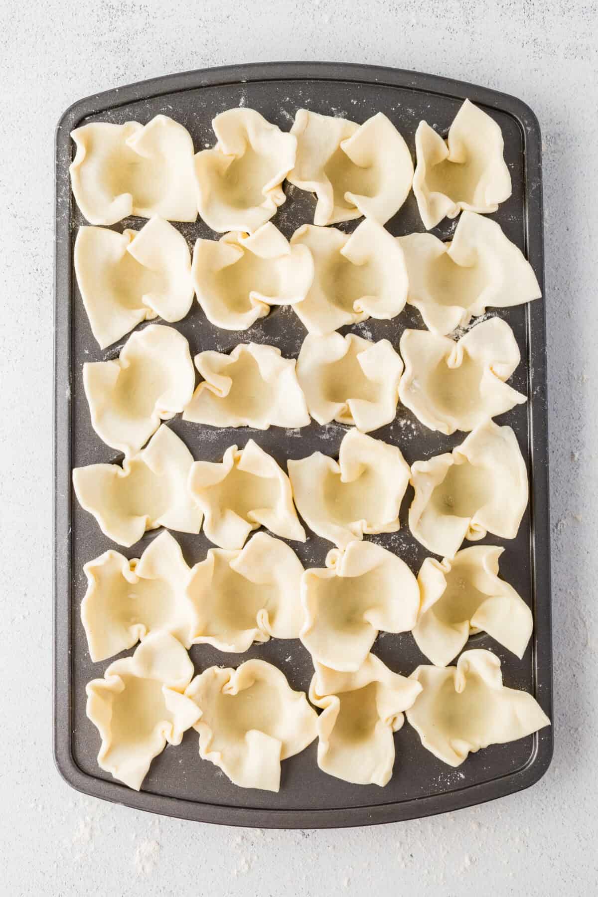 puff pastry squares pressed into mini muffin pan
