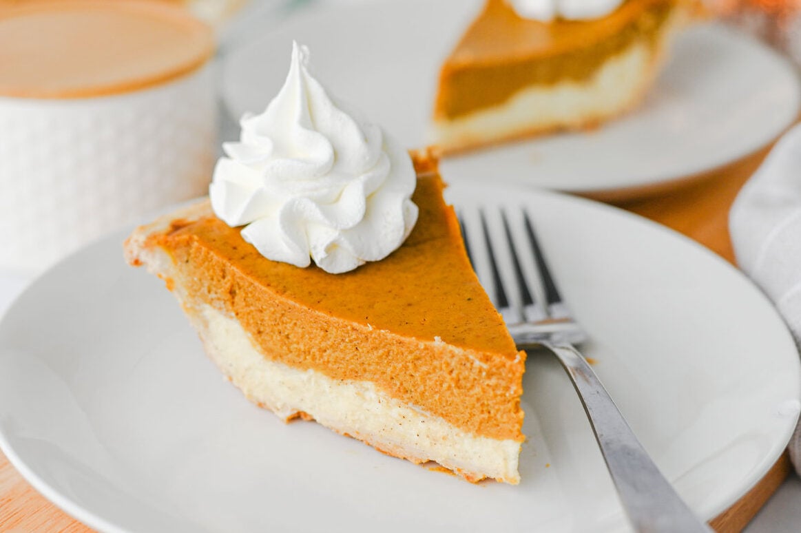 Slice of Pumpkin Cheesecake Pie on a white plate