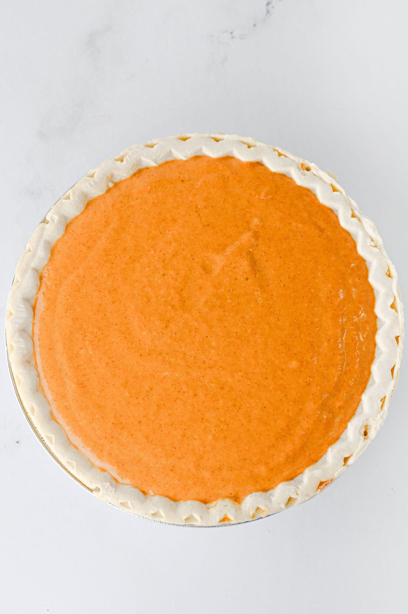 pumpkin cheesecake pie before baking