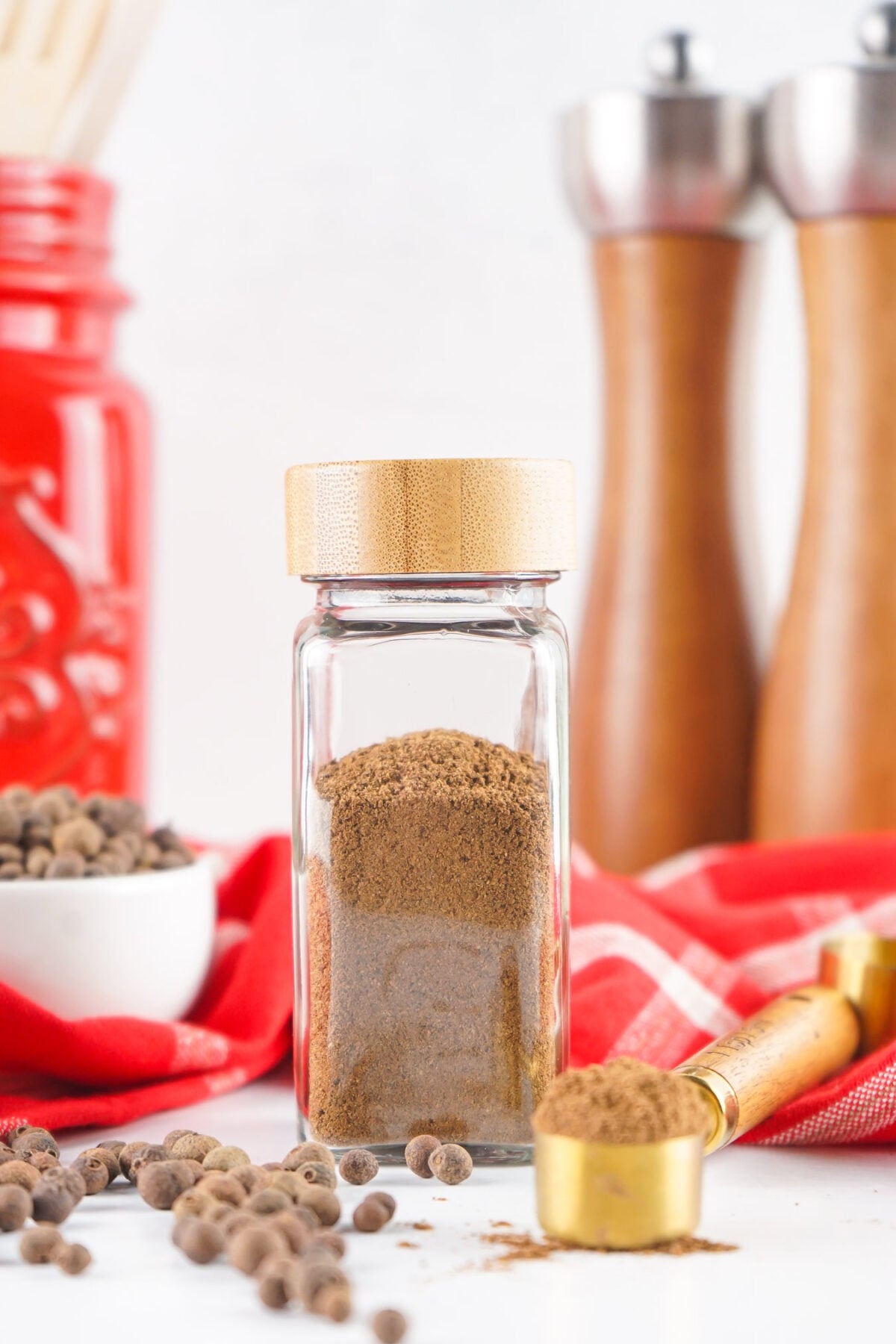 ground allspice in a spice jar