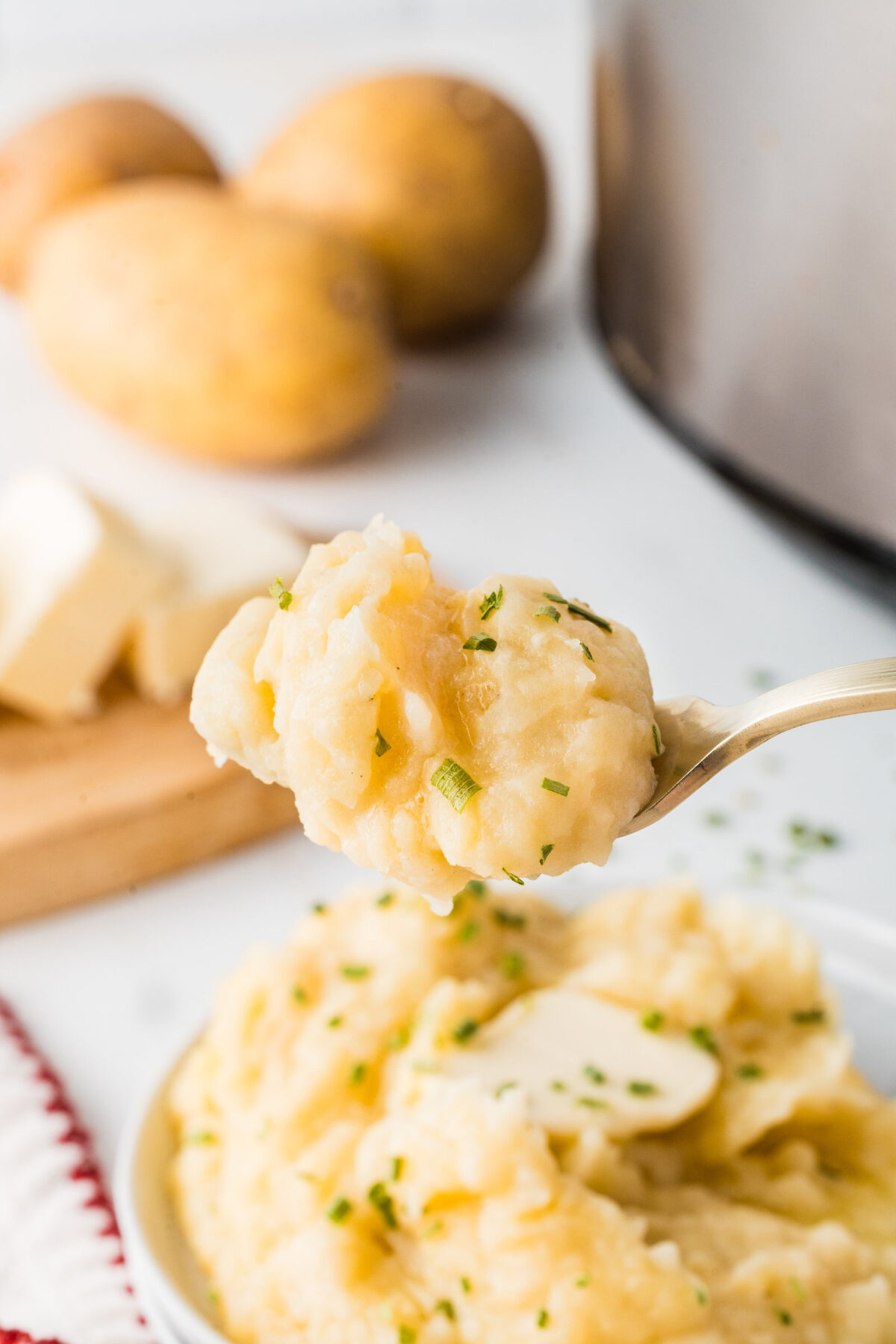 a forkful of crockpot mashed potatoes