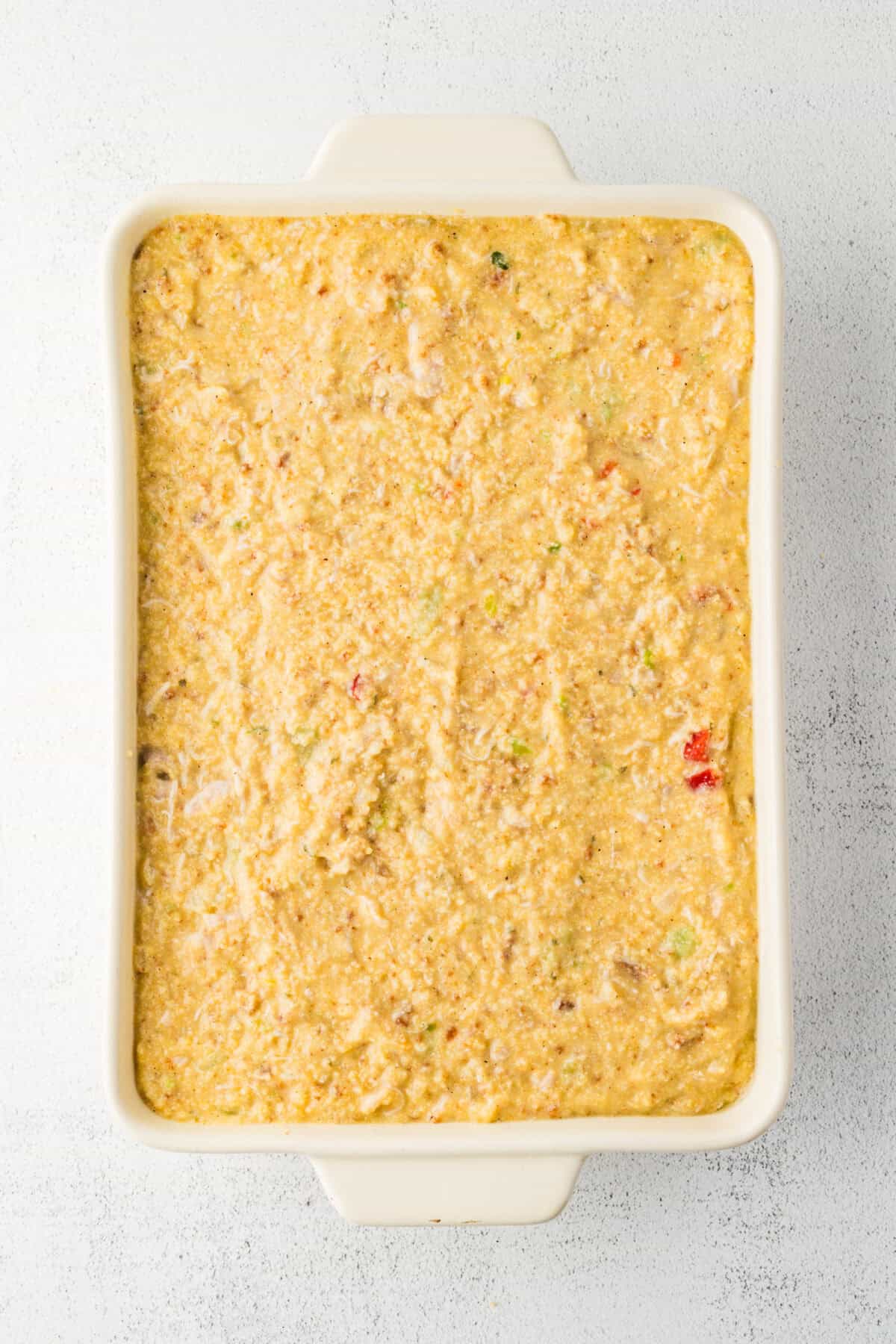 raw dressing spread in baking dish
