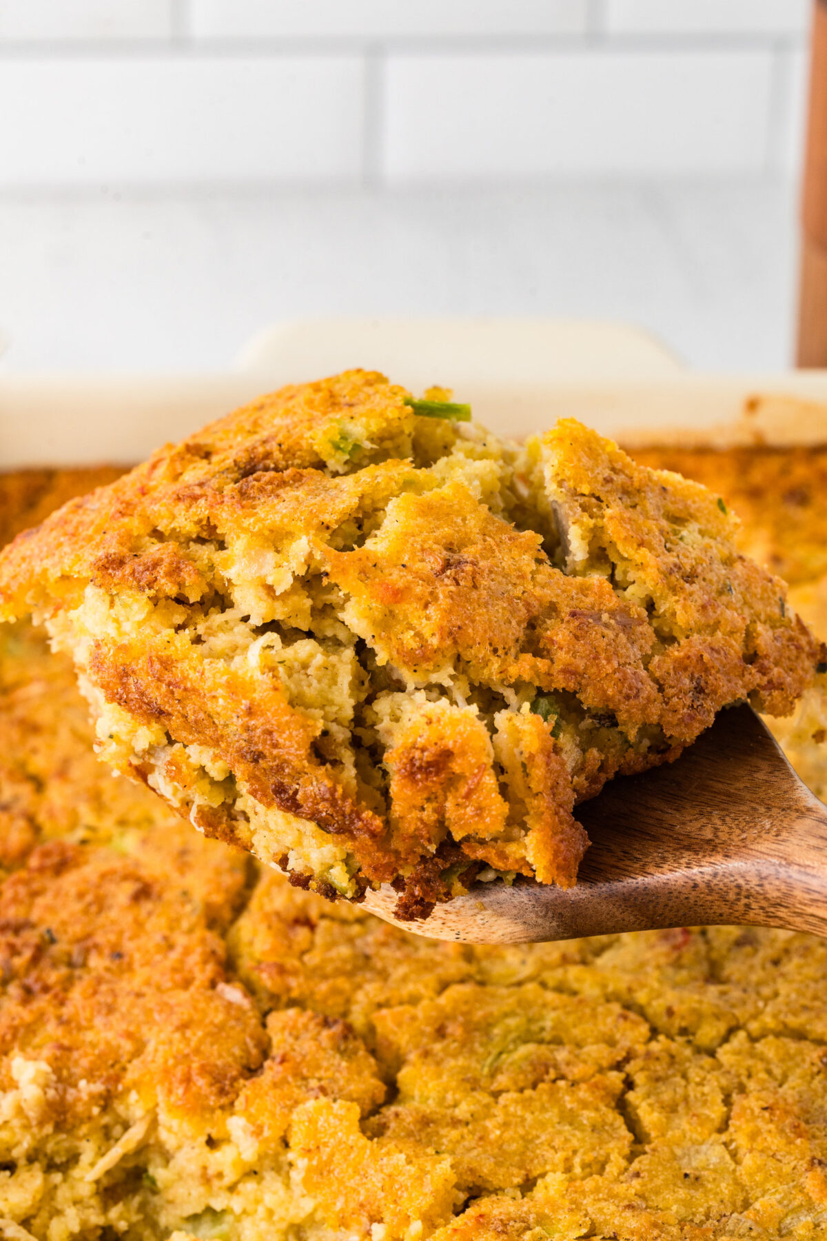 a wooden spoon full of cornbread dressing