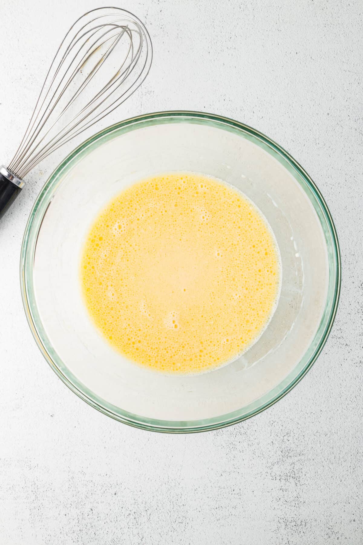 wet ingredients whisked together in a mixing bowl