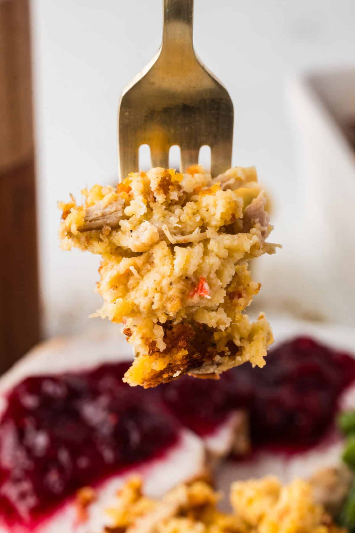 a bite of cornbread dressing on a fork