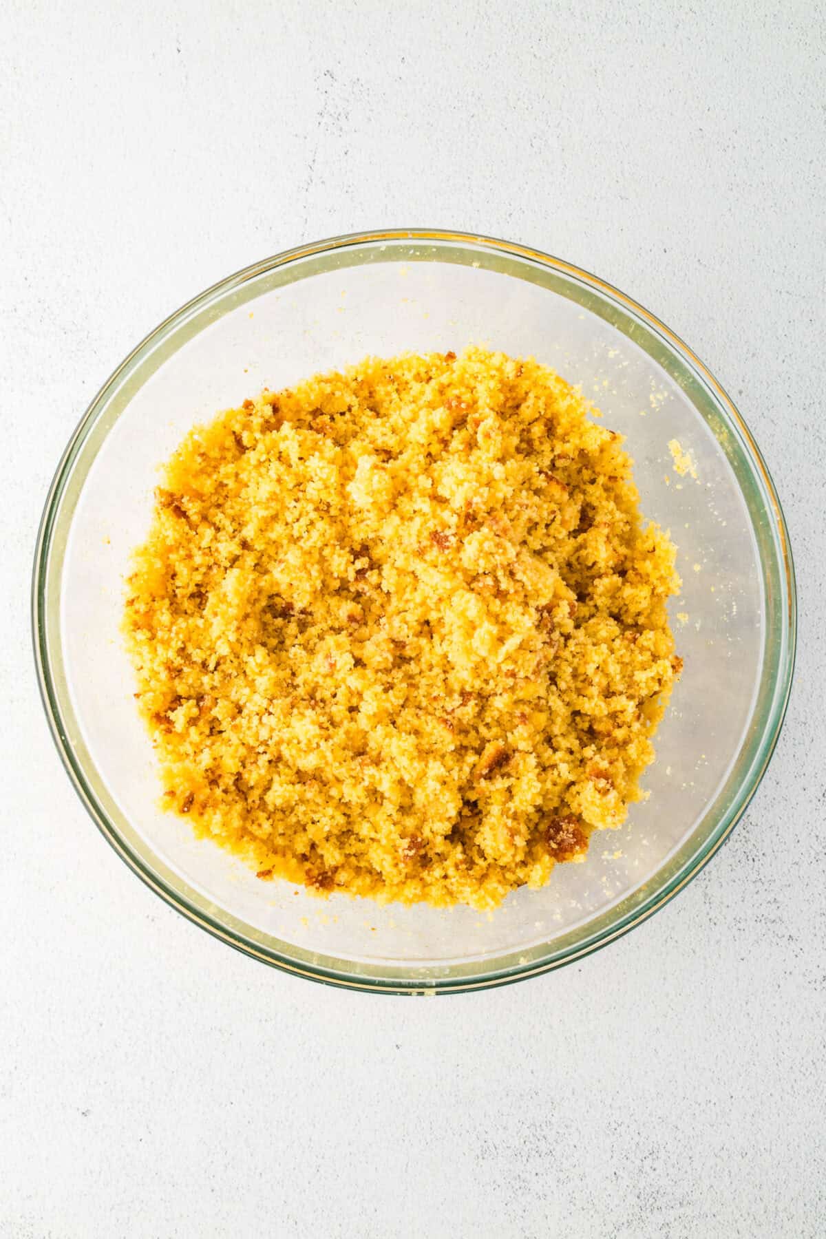 crumbled cornbread in a mixing bowl