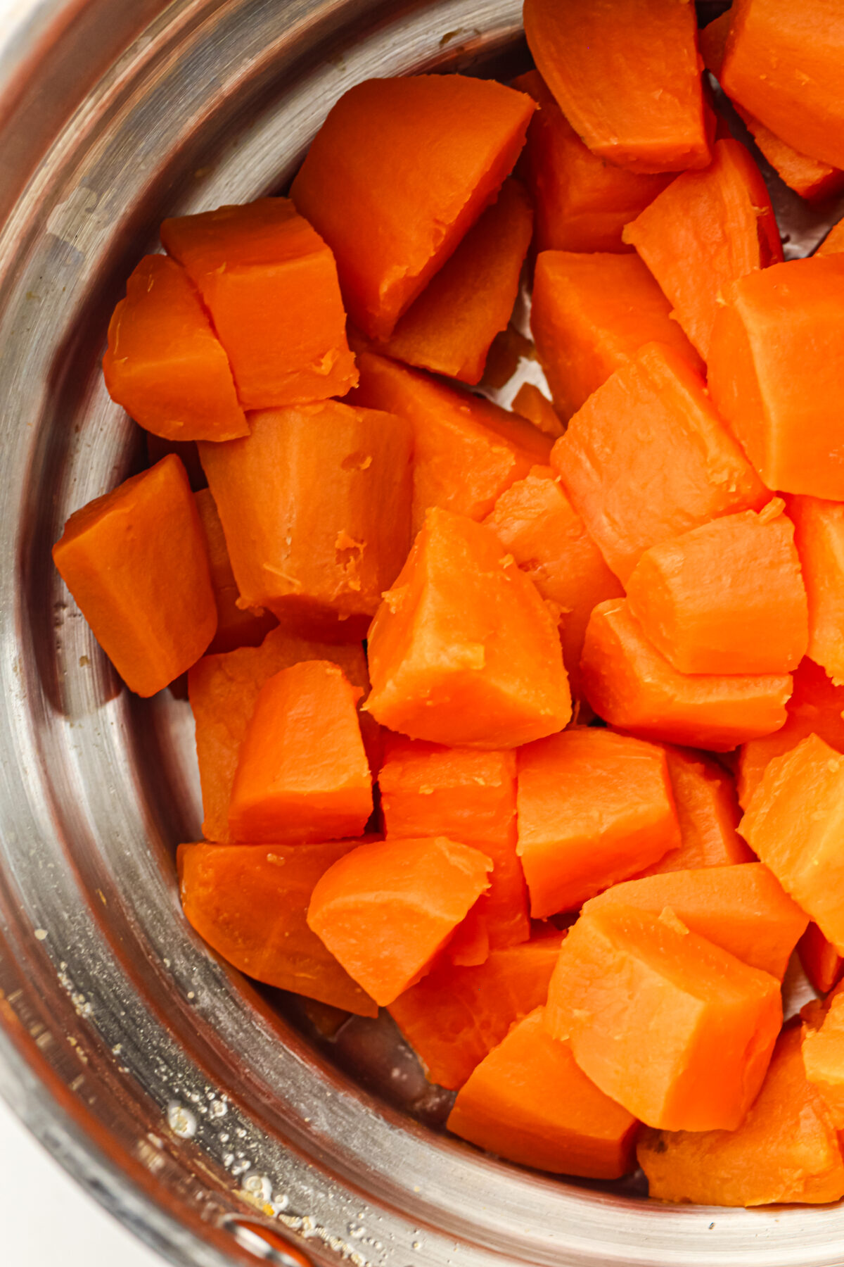 boiled sweet potatoes in a collander