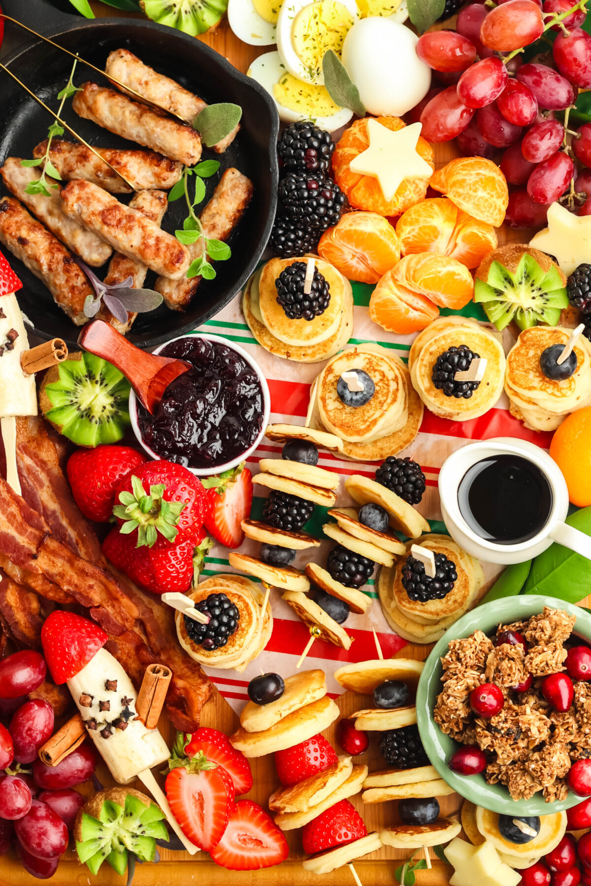 breakfast charcuterie board with mini pancakes and banana santa