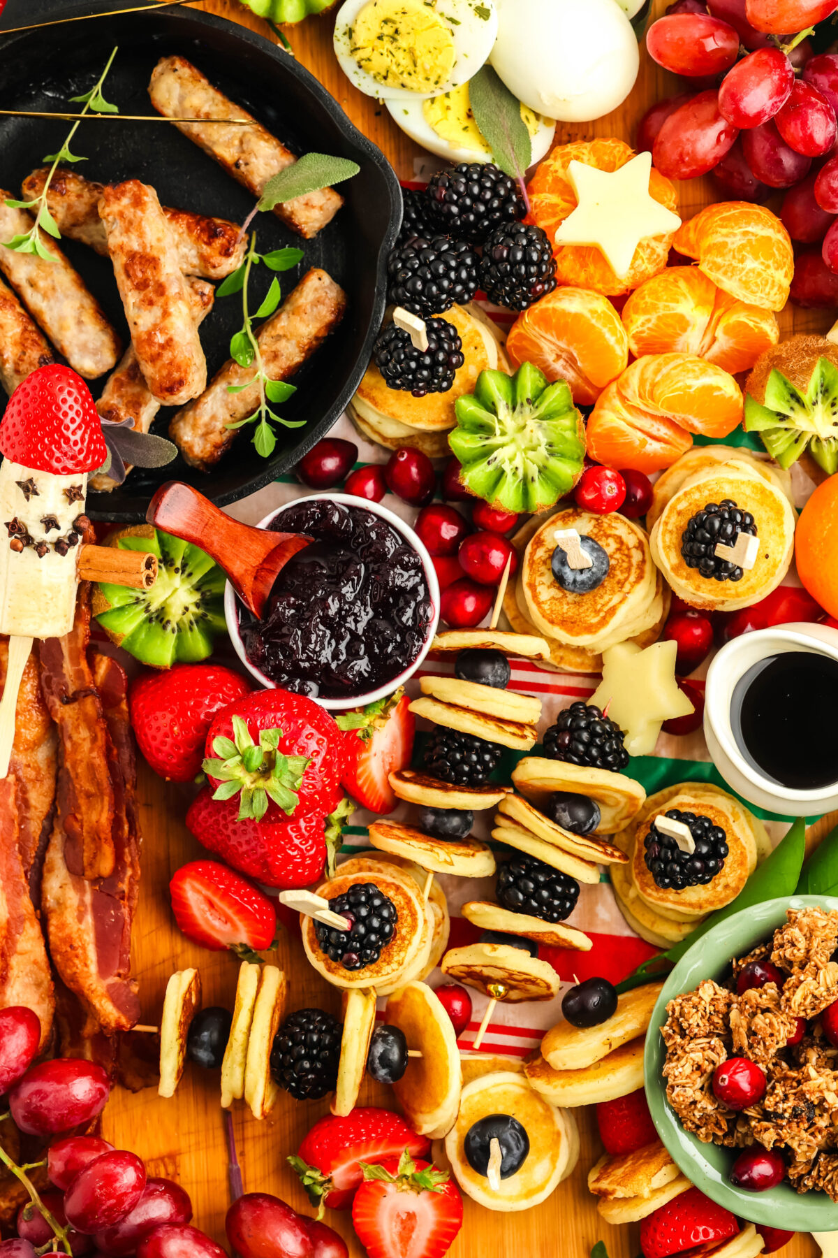 breakfast charcuterie board with mini pancakes and banana santa
