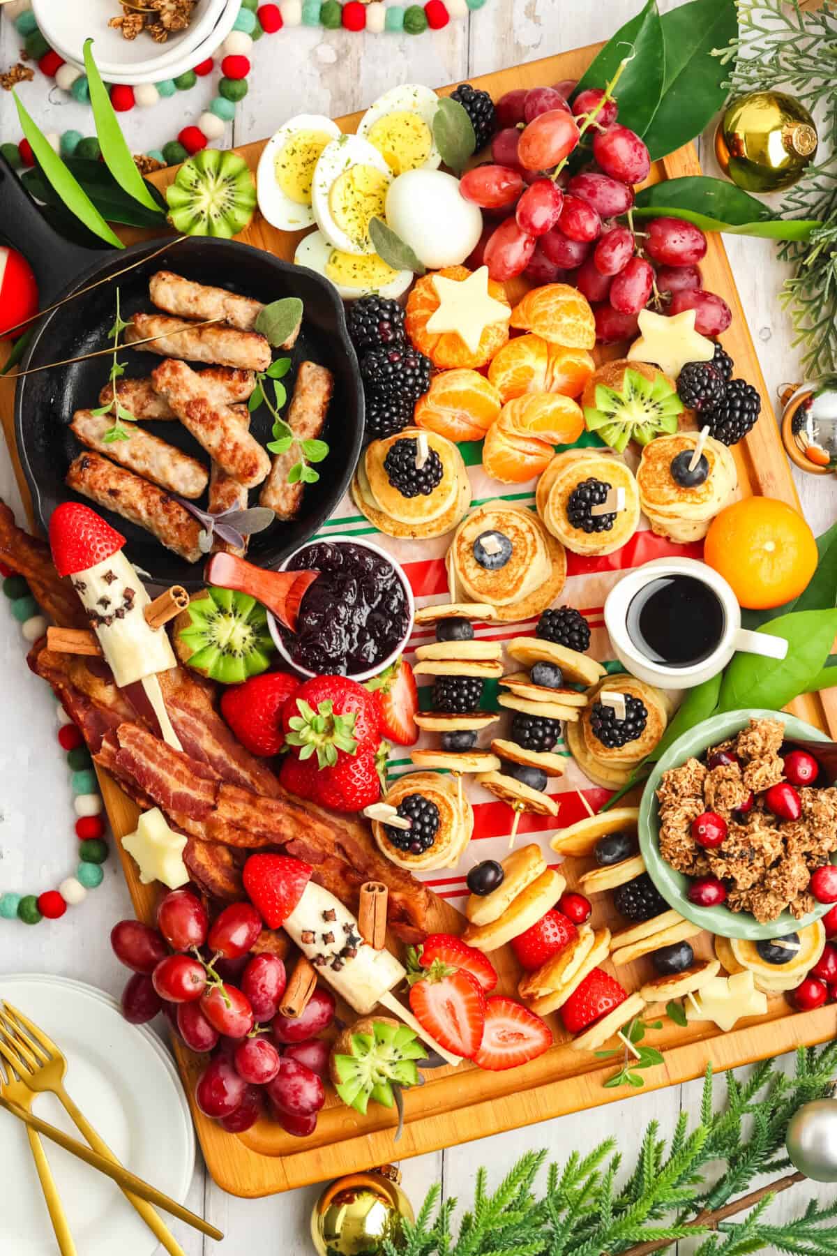 breakfast charcuterie board with mini pancakes and banana santa