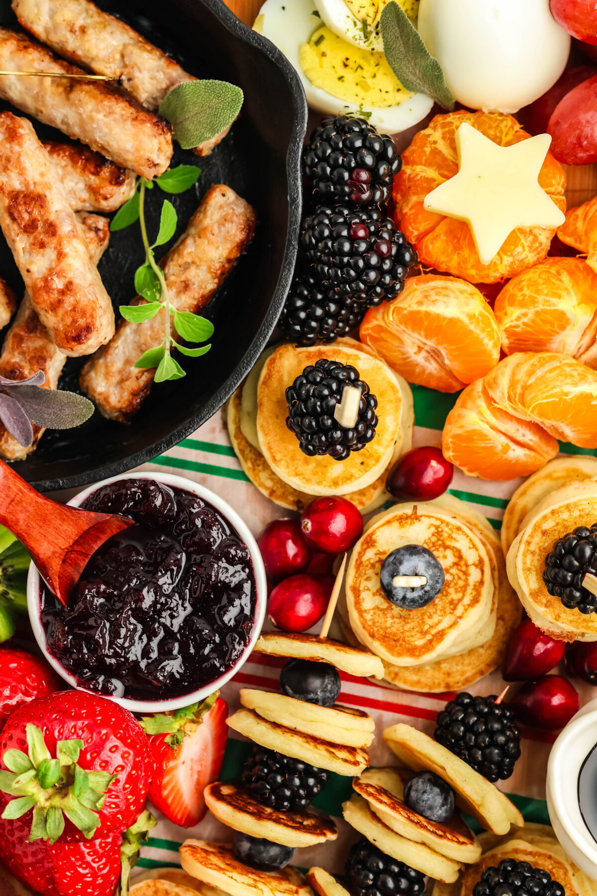 breakfast charcuterie board with mini pancakes and banana santa