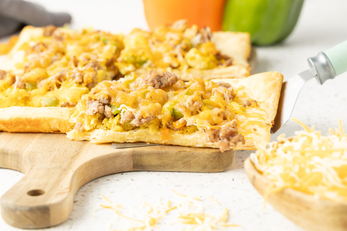 slices of breakfast pizza on a cutting board