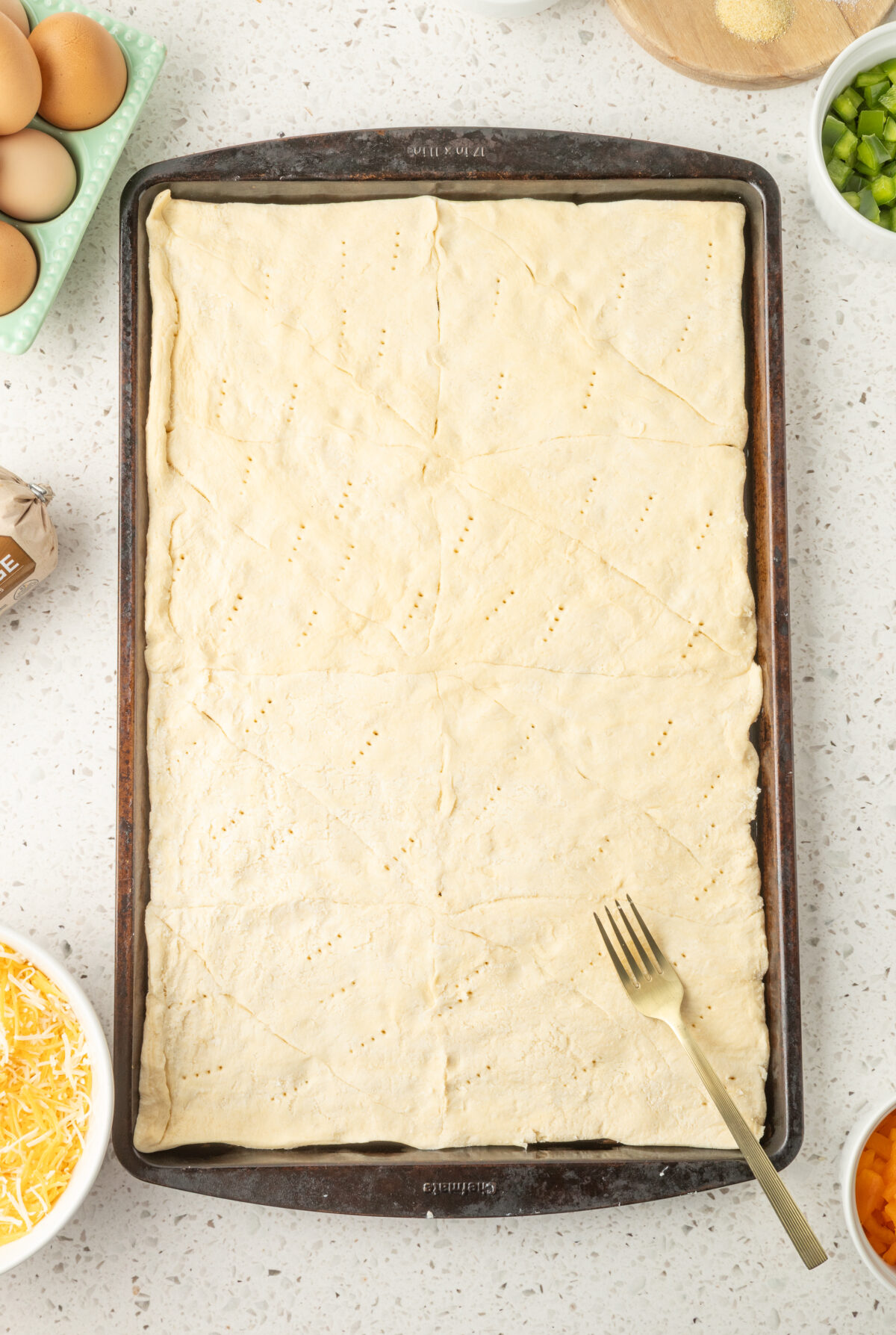 raw crescent dough on a baking sheet