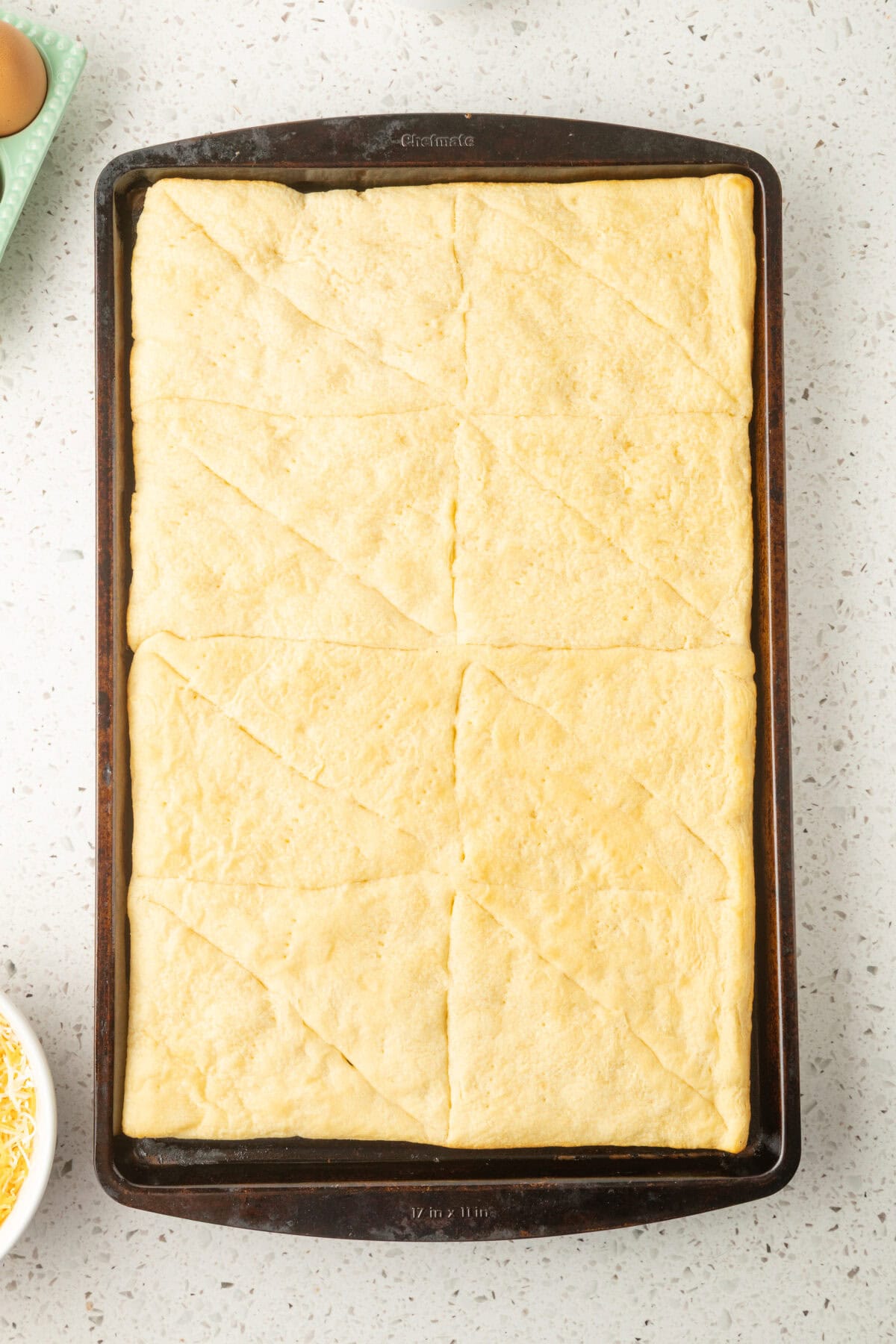 baked crescent roll on a baking sheet