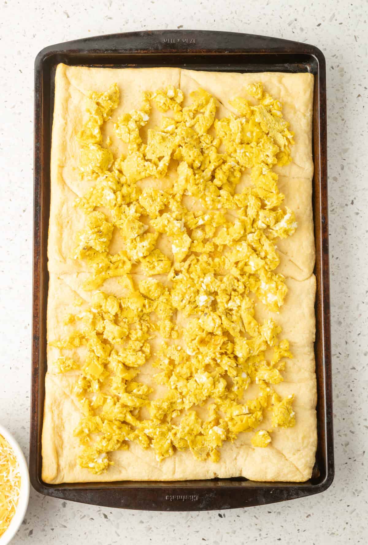 scrambled eggs on baked crescent dough