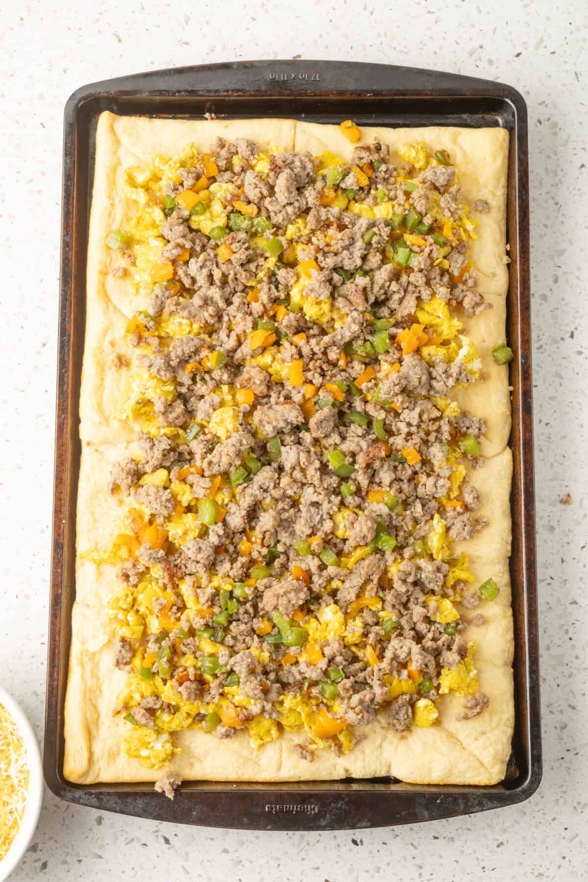 meat and veggies on top of the eggs