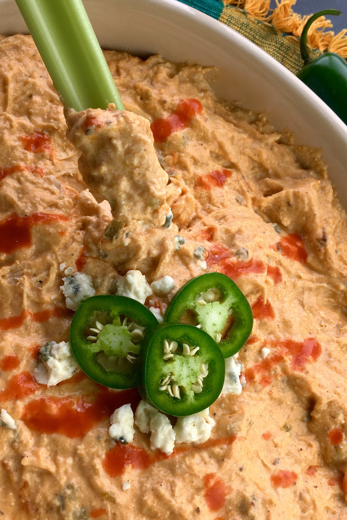 buffalo chicken dip with a celery stick