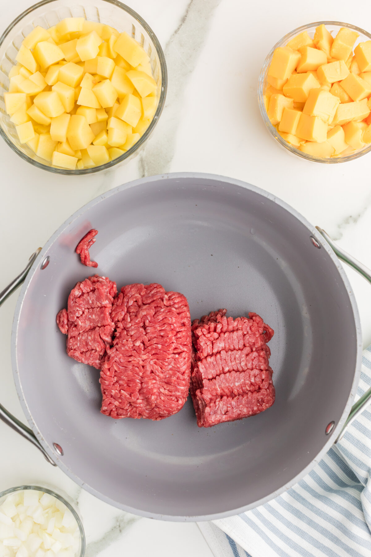 raw ground beef in a skillet
