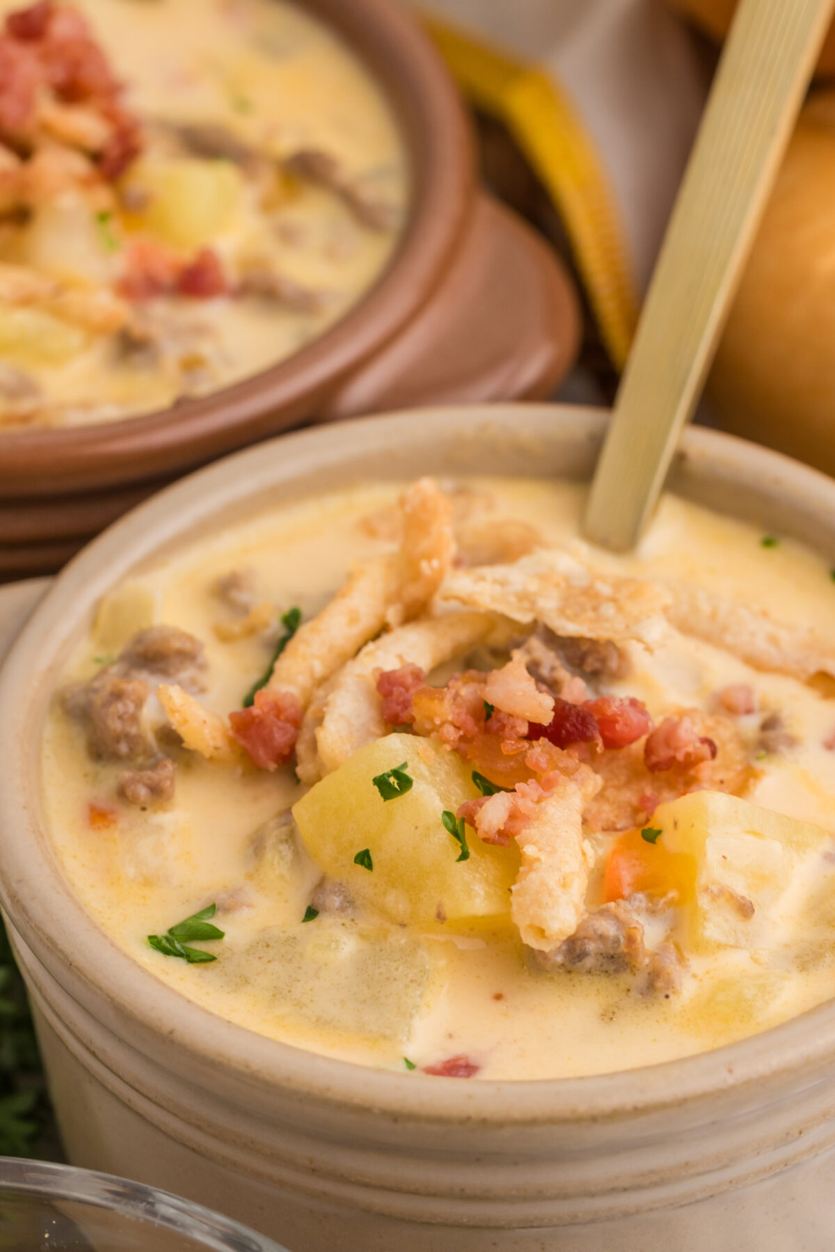 cheeseburger soup in a brown bowl