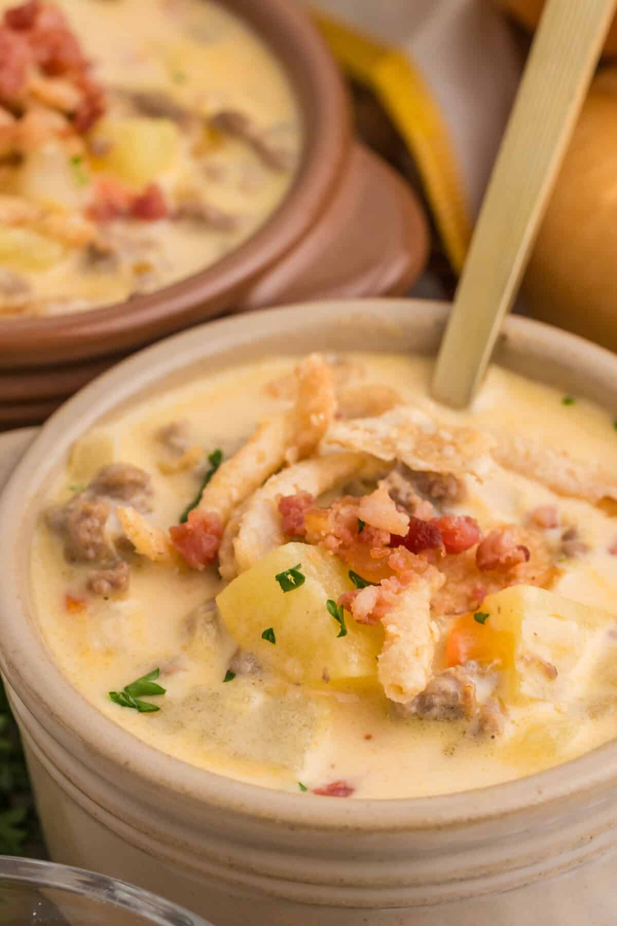 cheeseburger soup in a brown bowl