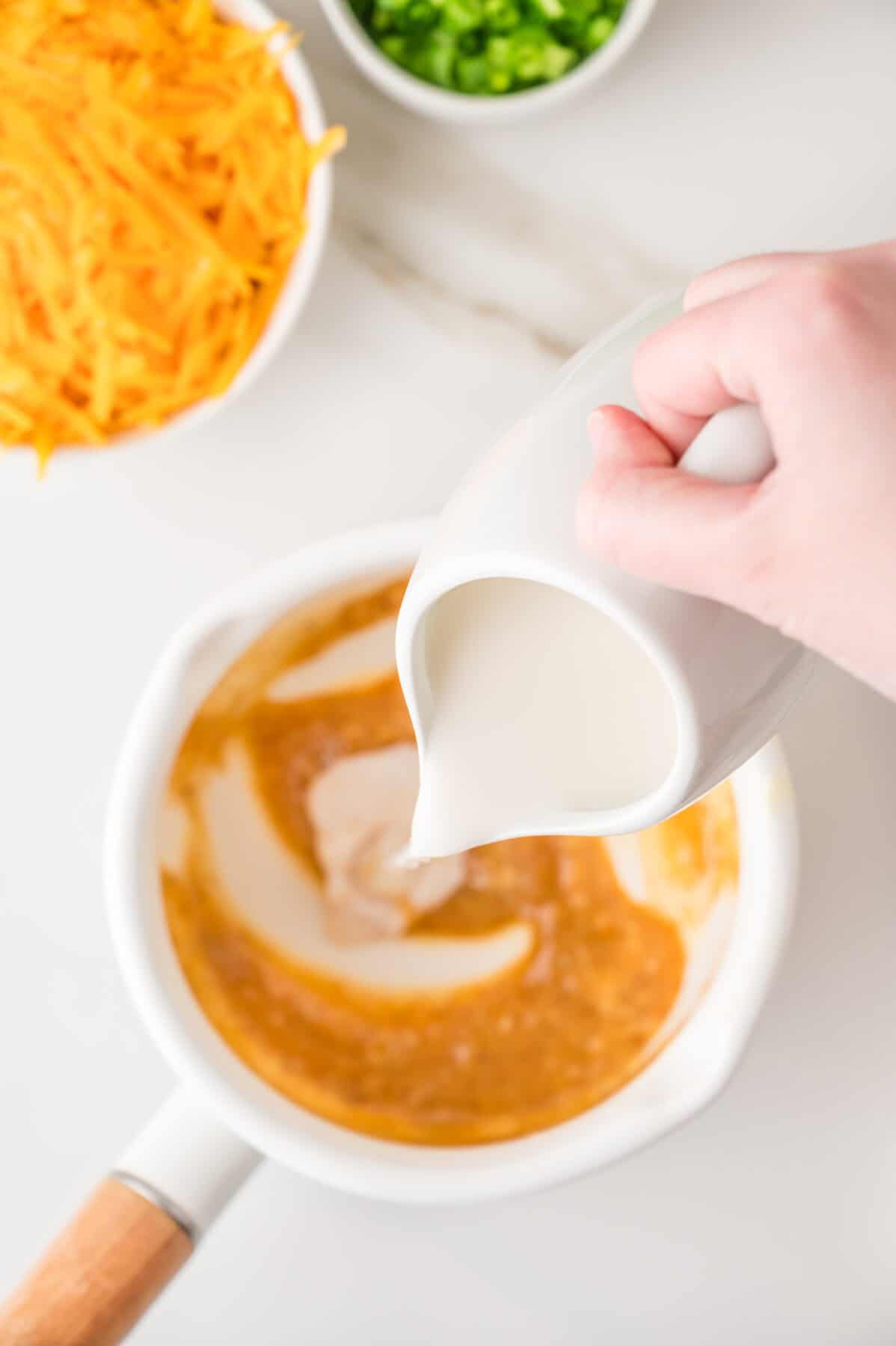 adding milk to the butter mixture