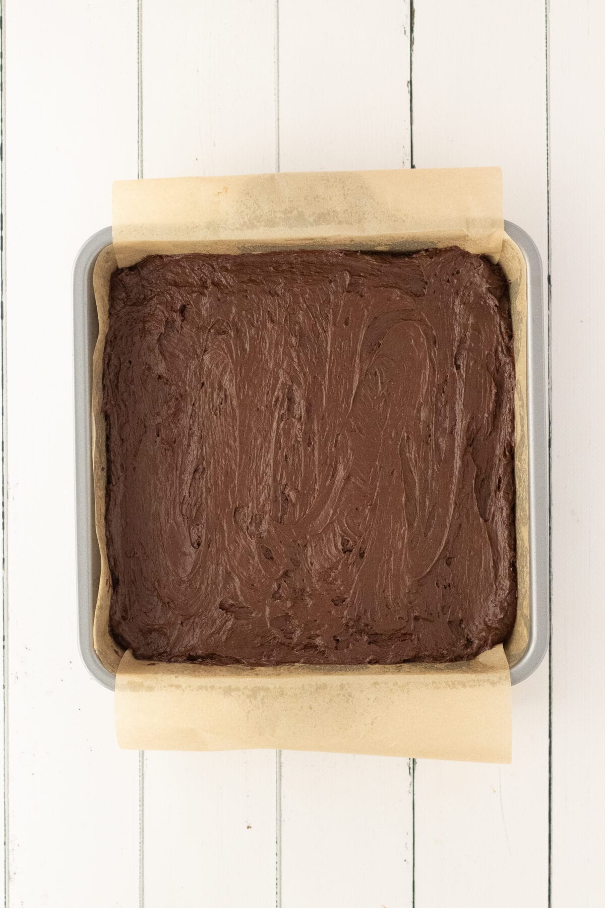 chilled candy filling in a parchment lined pan