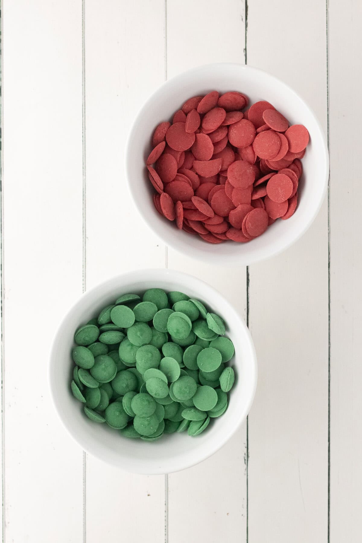 red and green candy melts in bowls