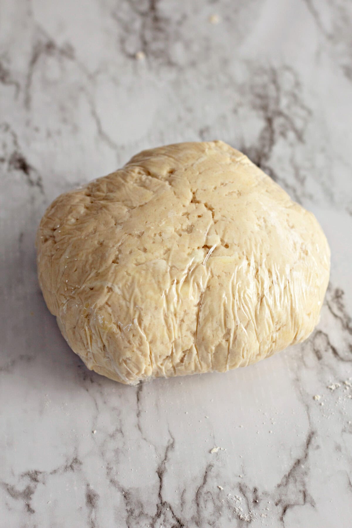 crescent roll dough in plastic wrap